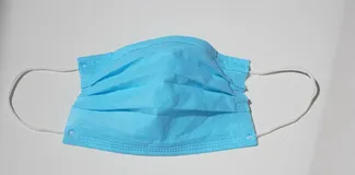 Photo of NYSE wearing surgical mask